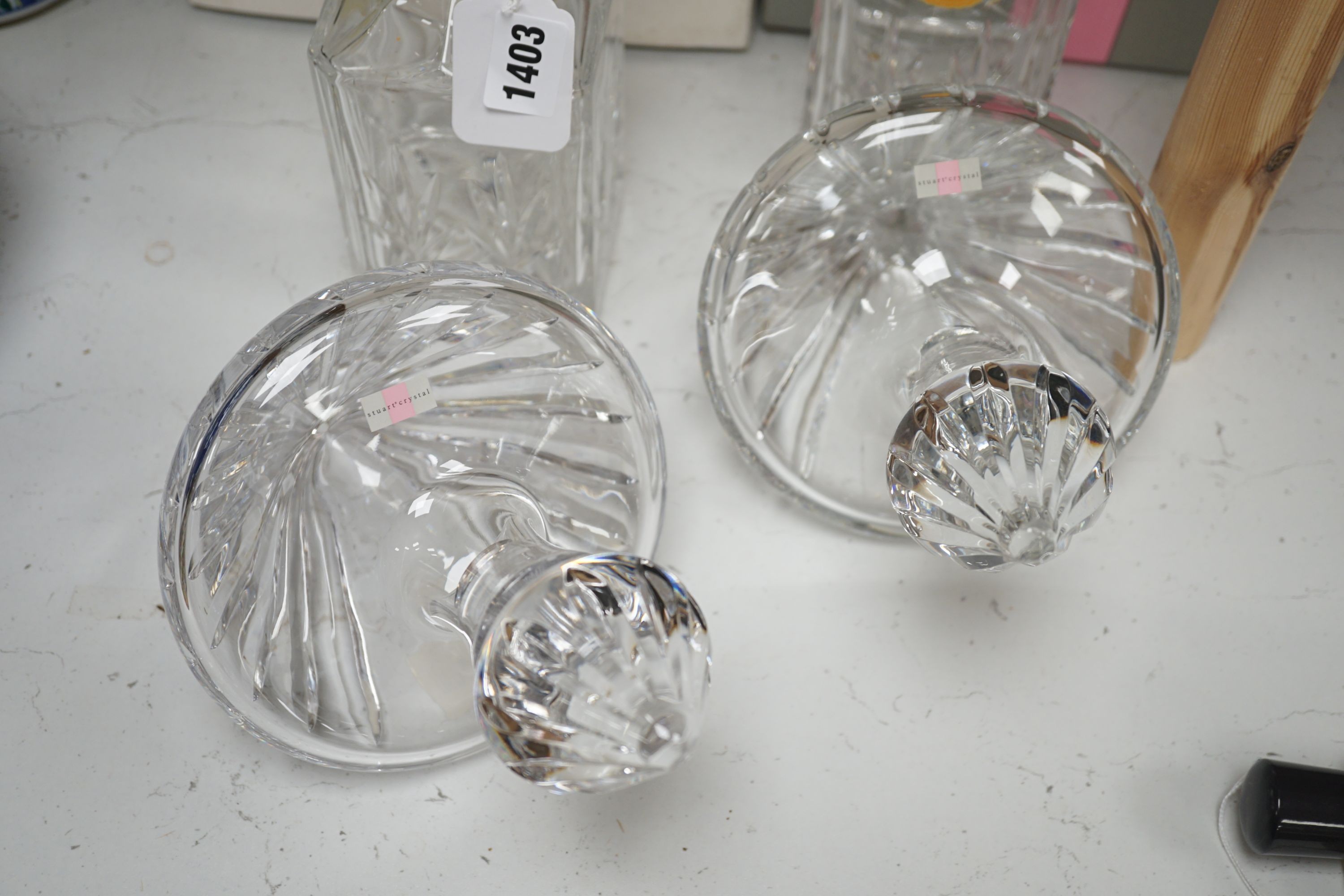 A pair of spirit decanters and a boxed pair of novelty Stuart 'rest' decanters.